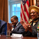 US President Donald Trump (L) sits next to Terrence Williams and Angela Stanton-King (R) during a meeting with African-American leaders in the Cabinet Room of the White House in Washington, DC, on February 27, 2020.